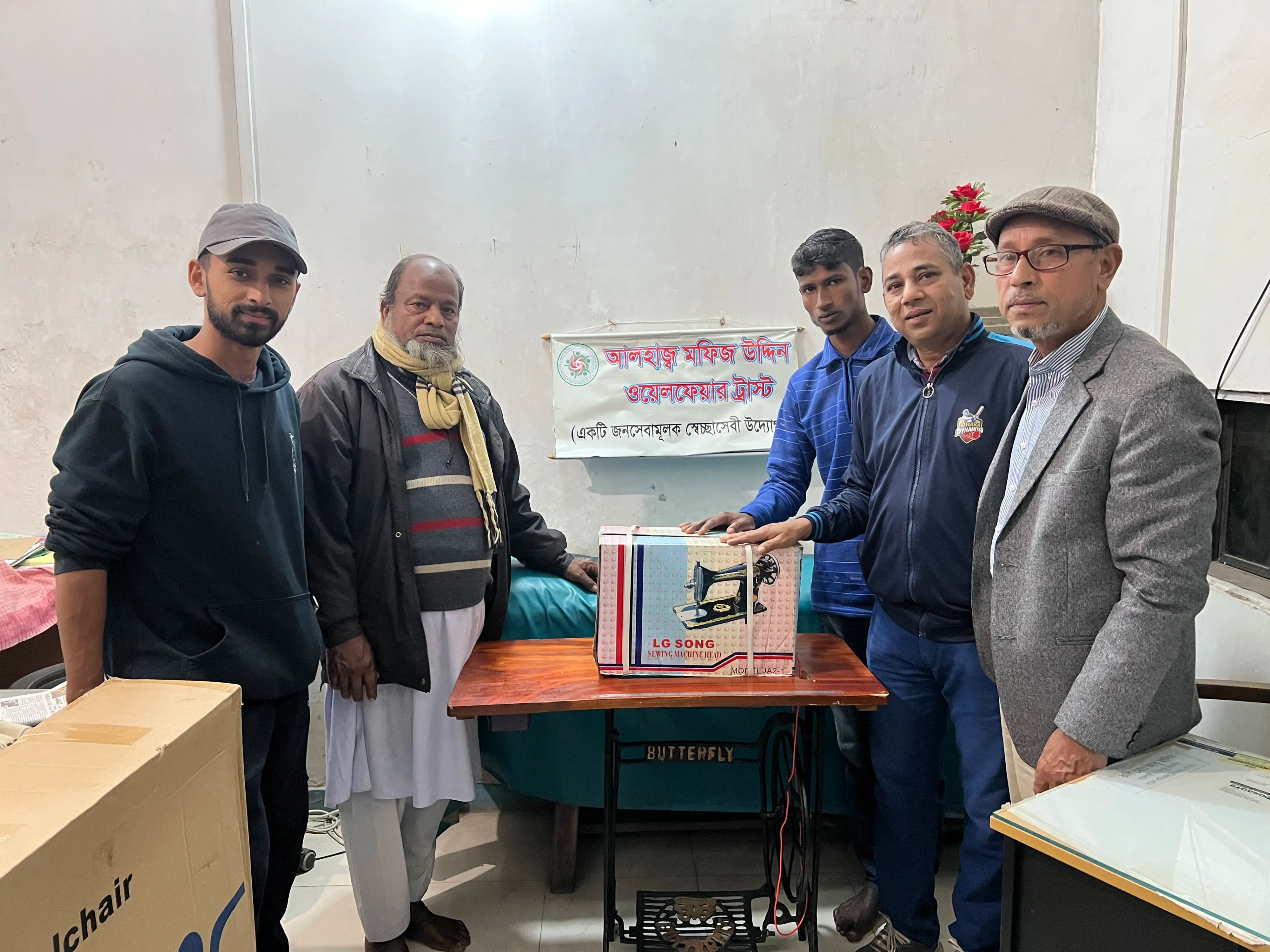 Image - Welfare trust members with sewing machine
